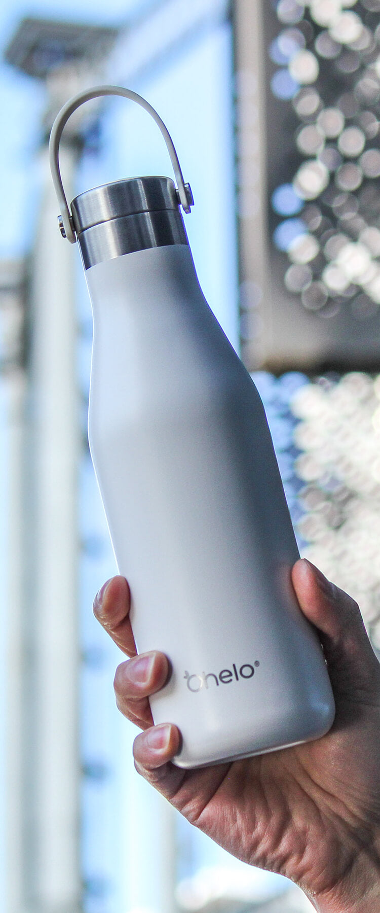 White stainless steel reusable water bottle by Ohelo