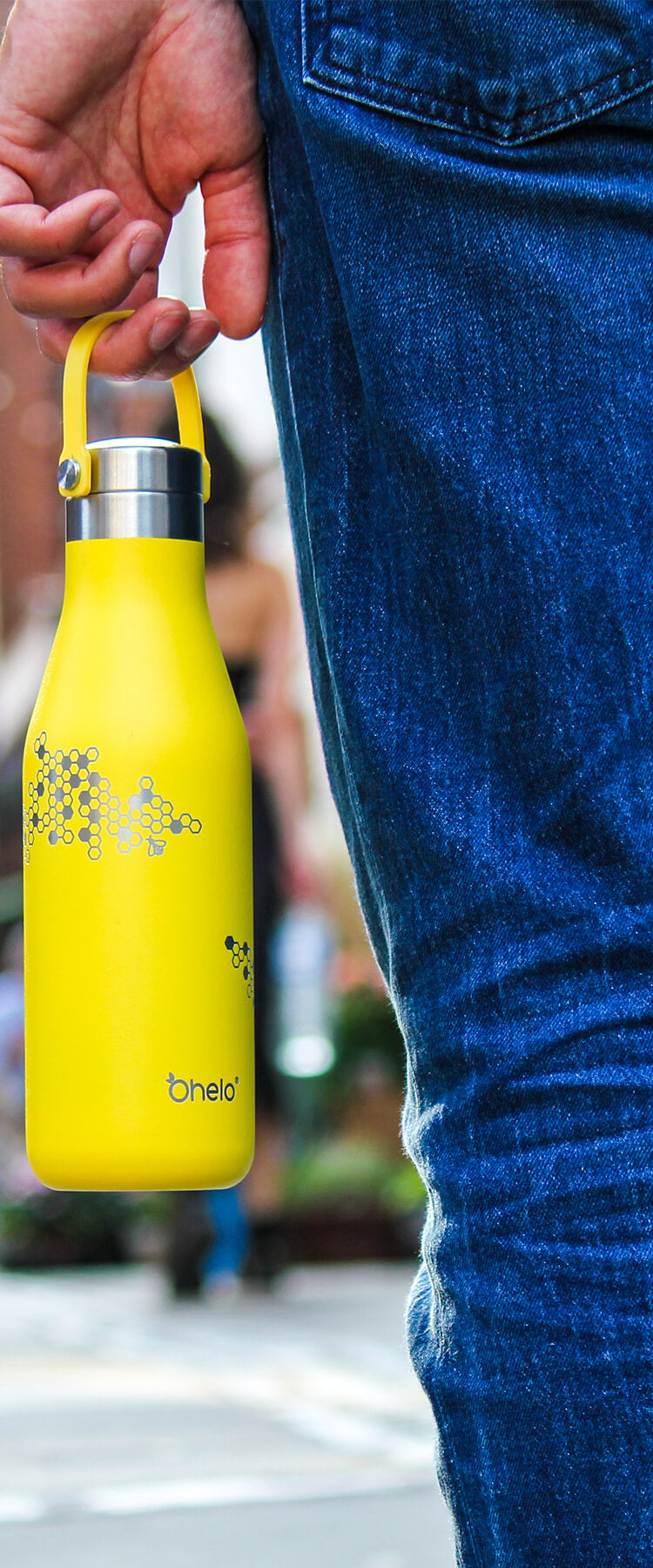 Ohelo insulated reusable water bottle in yellow with honeycomb and bee design