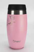 Rotational video of Ohelo leakproof reusable coffee cup in pink with laser etched cherry blossom design