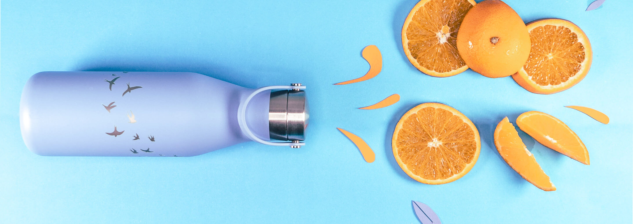 Ohelo blue swallows insulated bottle with orange segments and splashes exploding from the top
